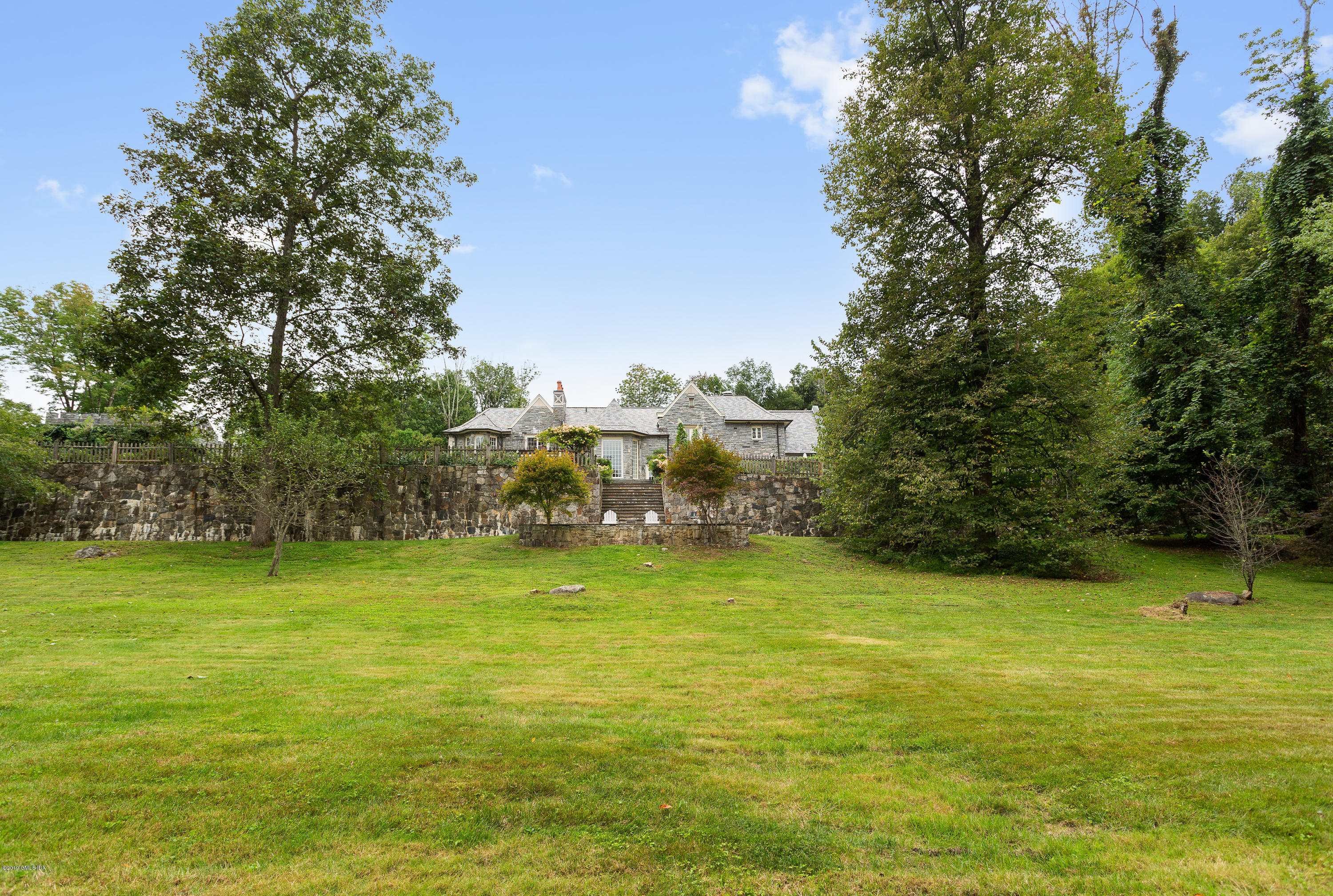17 Cameron Drive Greenwich, CT 06831 - Photo 37 of 41 a view of a green field with lots of bushes