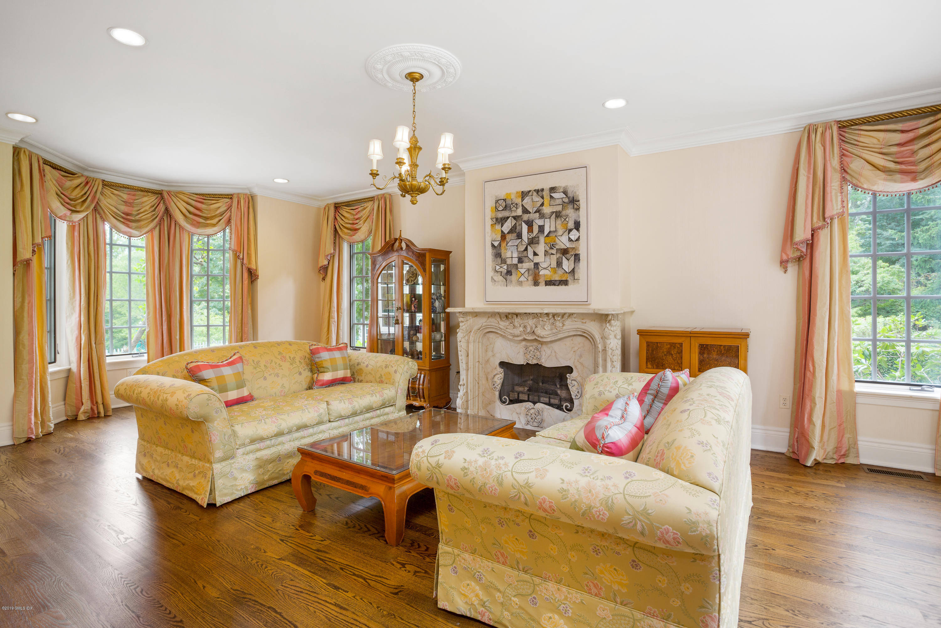 17 Cameron Drive Greenwich, CT 06831 - Photo 6 of 41 a living room with furniture and a fireplace