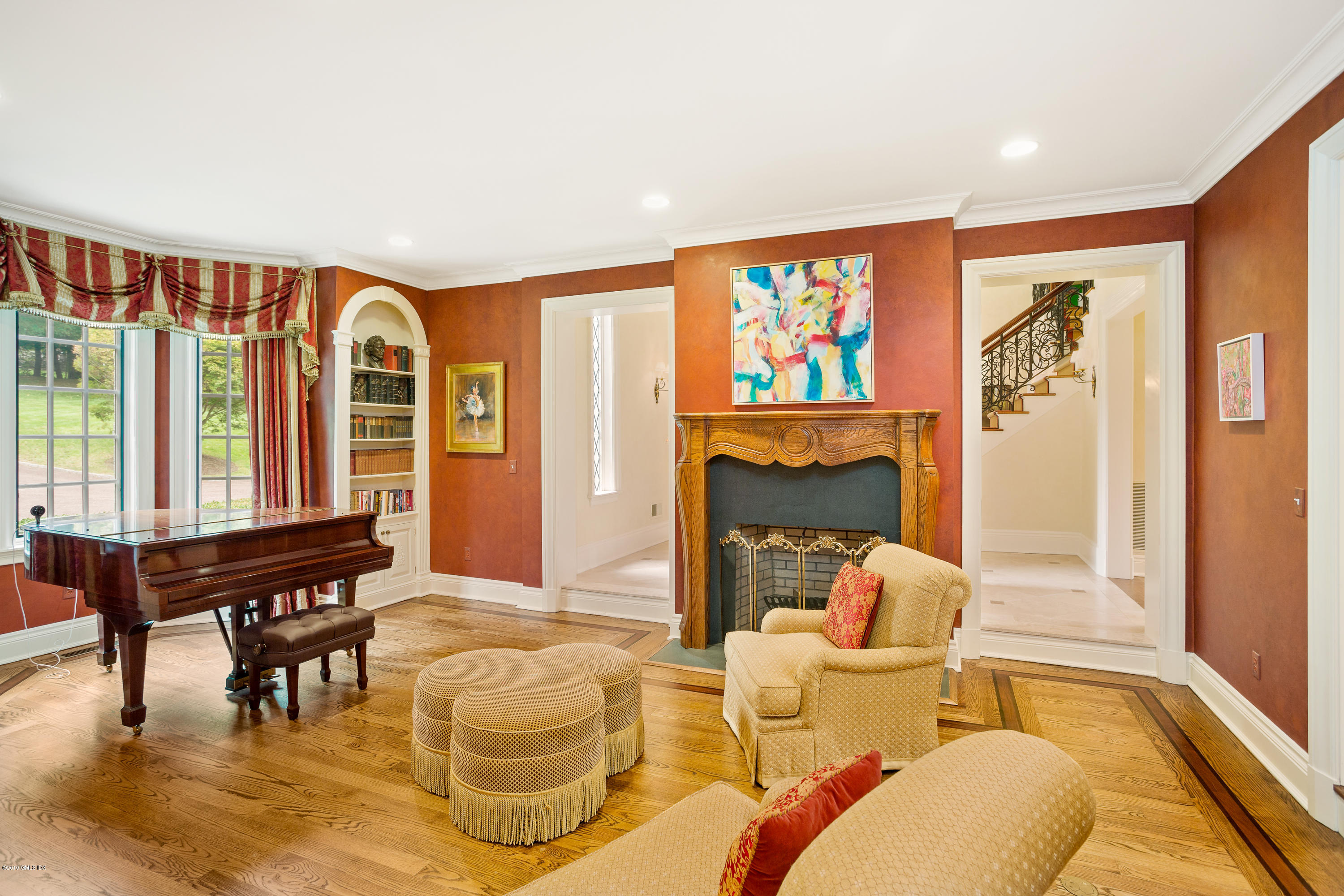 17 Cameron Drive Greenwich, CT 06831 - Photo 7 of 41 a living room with fireplace furniture and a large window