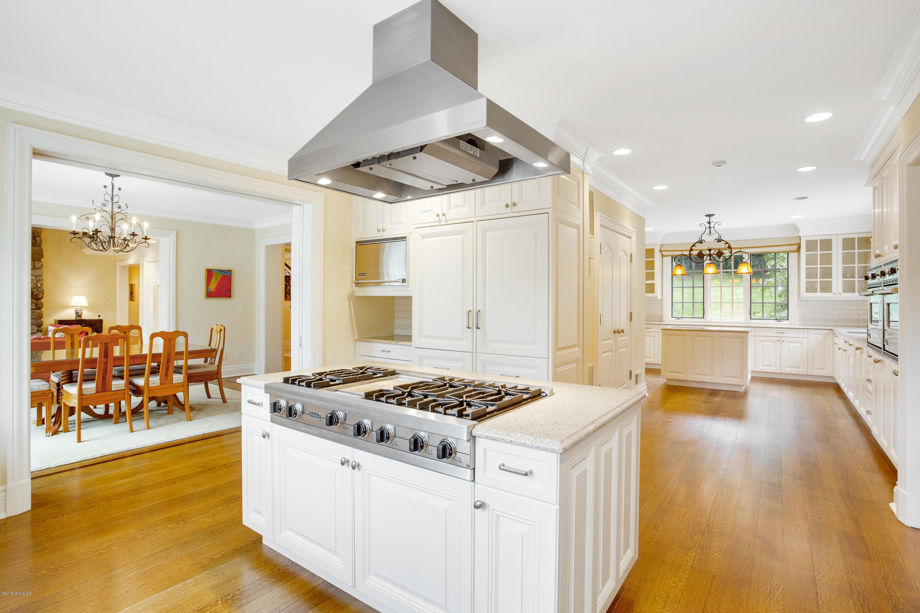 17 Cameron Drive Greenwich, CT 06831 - Photo 10 of 41 a kitchen with stainless steel appliances granite countertop a sink stove and refrigerator
