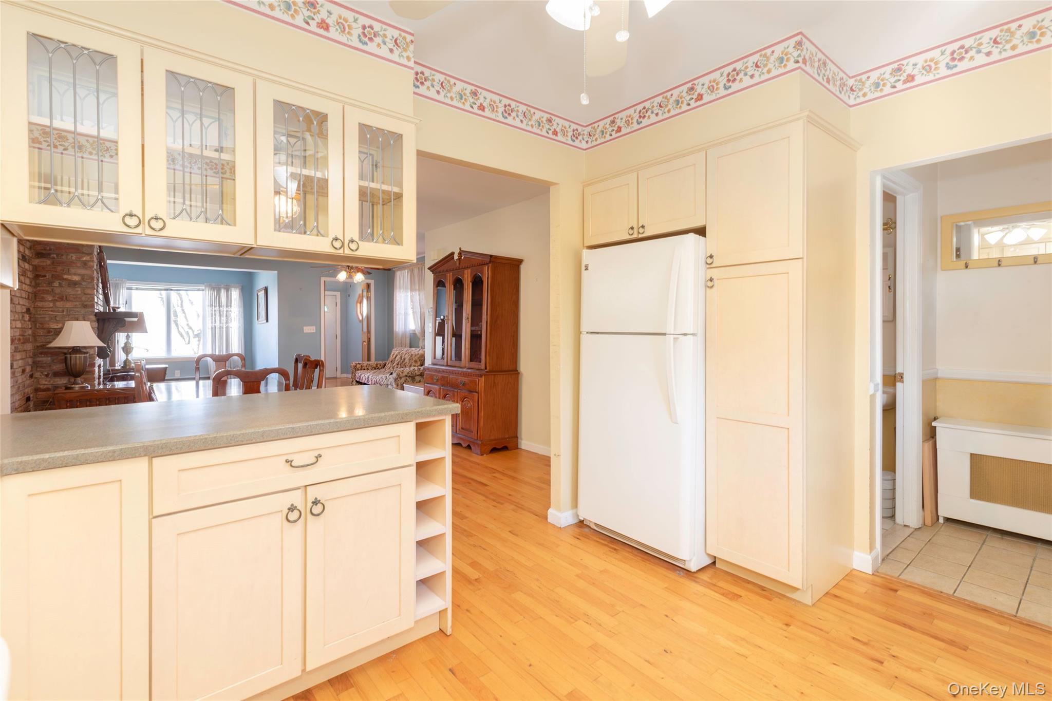100 Marine Street Bronx, NY 10464 - Photo 11 of 25 a kitchen with stainless steel appliances a refrigerator and a sink