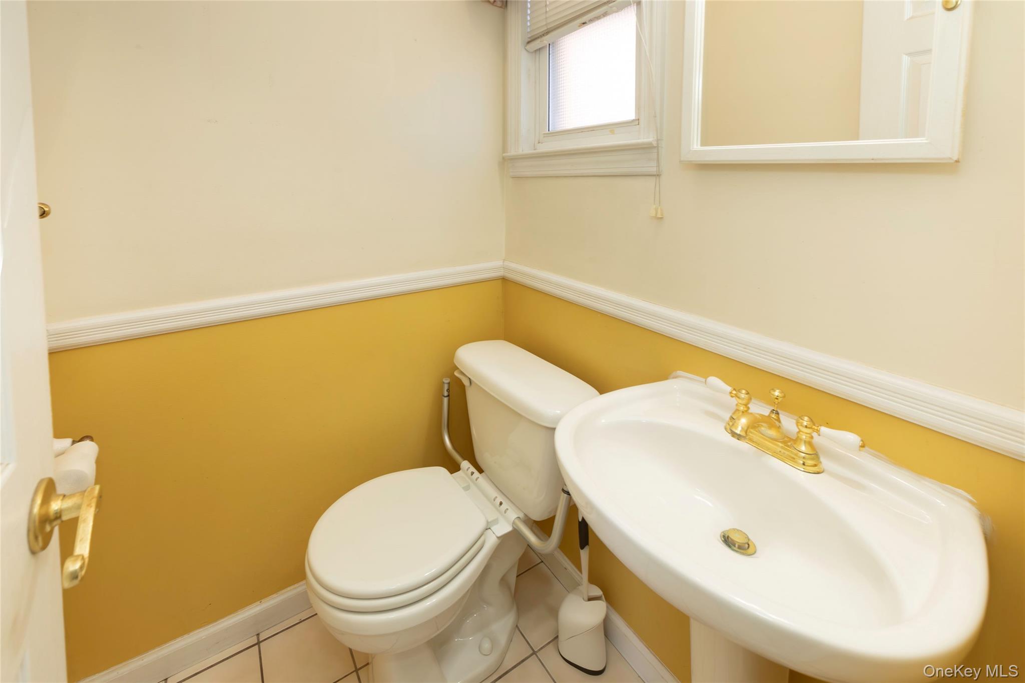 100 Marine Street Bronx, NY 10464 - Photo 12 of 25 a bathroom with a sink and a toilet