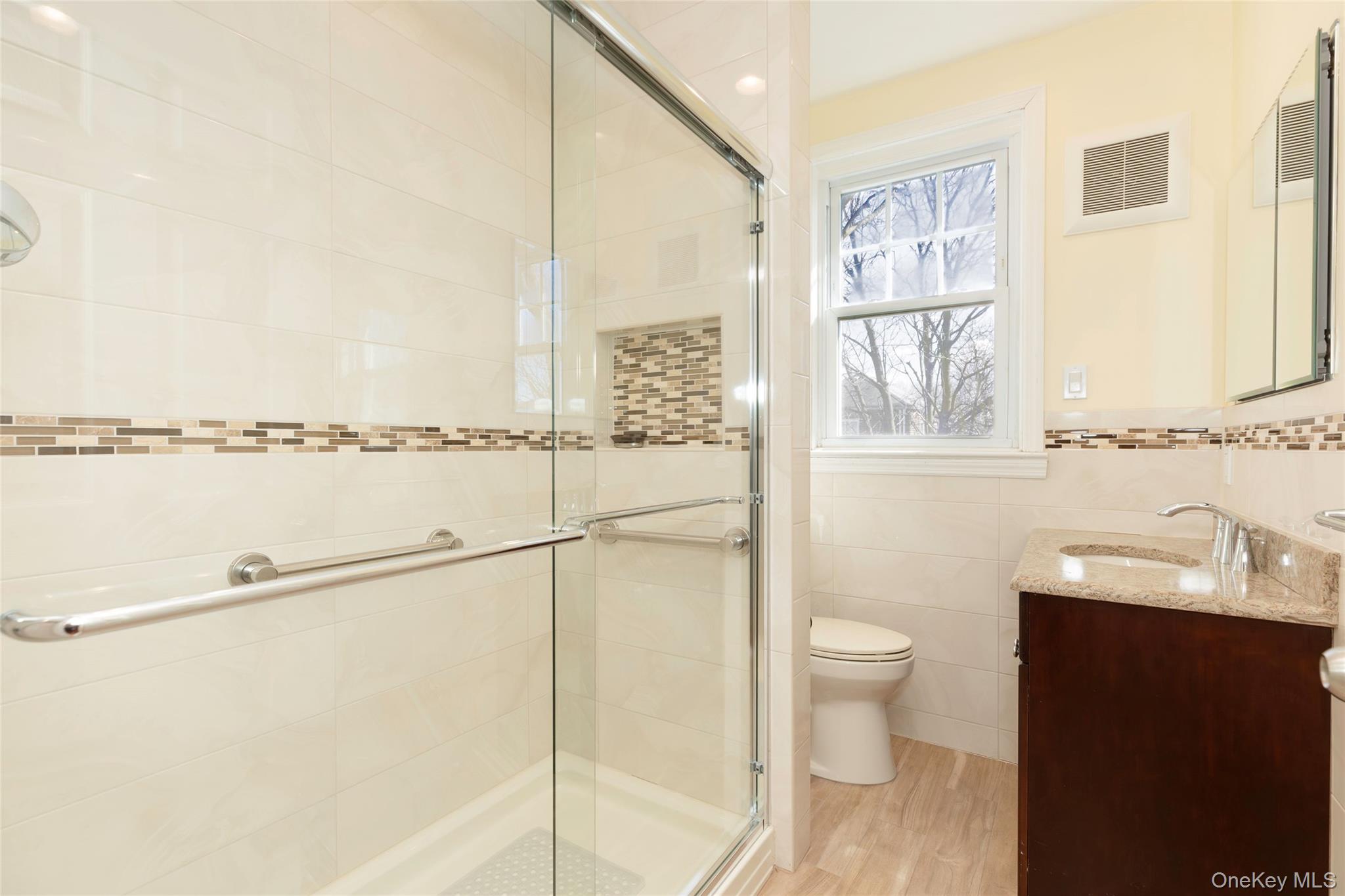 100 Marine Street Bronx, NY 10464 - Photo 13 of 25 a bathroom with a sink toilet and shower