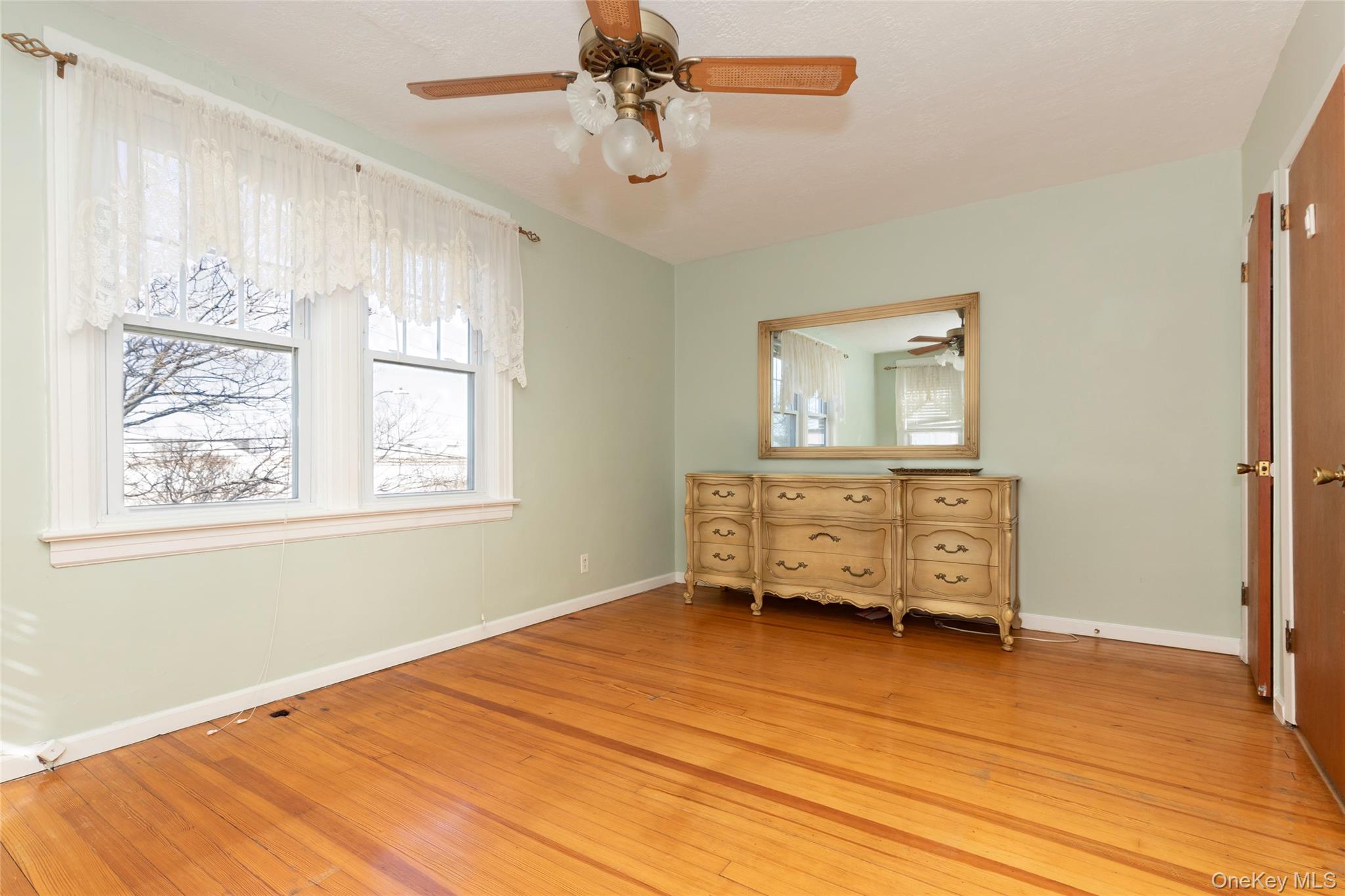 100 Marine Street Bronx, NY 10464 - Photo 20 of 25 a room with a dresser and a window