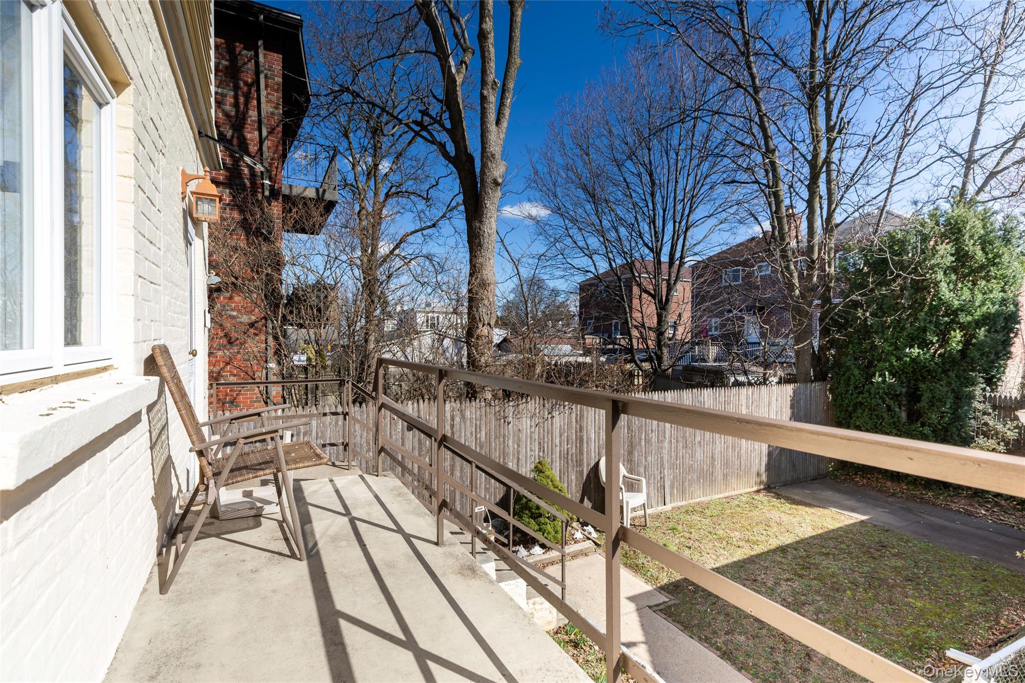 100 Marine Street Bronx, NY 10464 - Photo 22 of 25 a view of balcony with wooden floor and fence