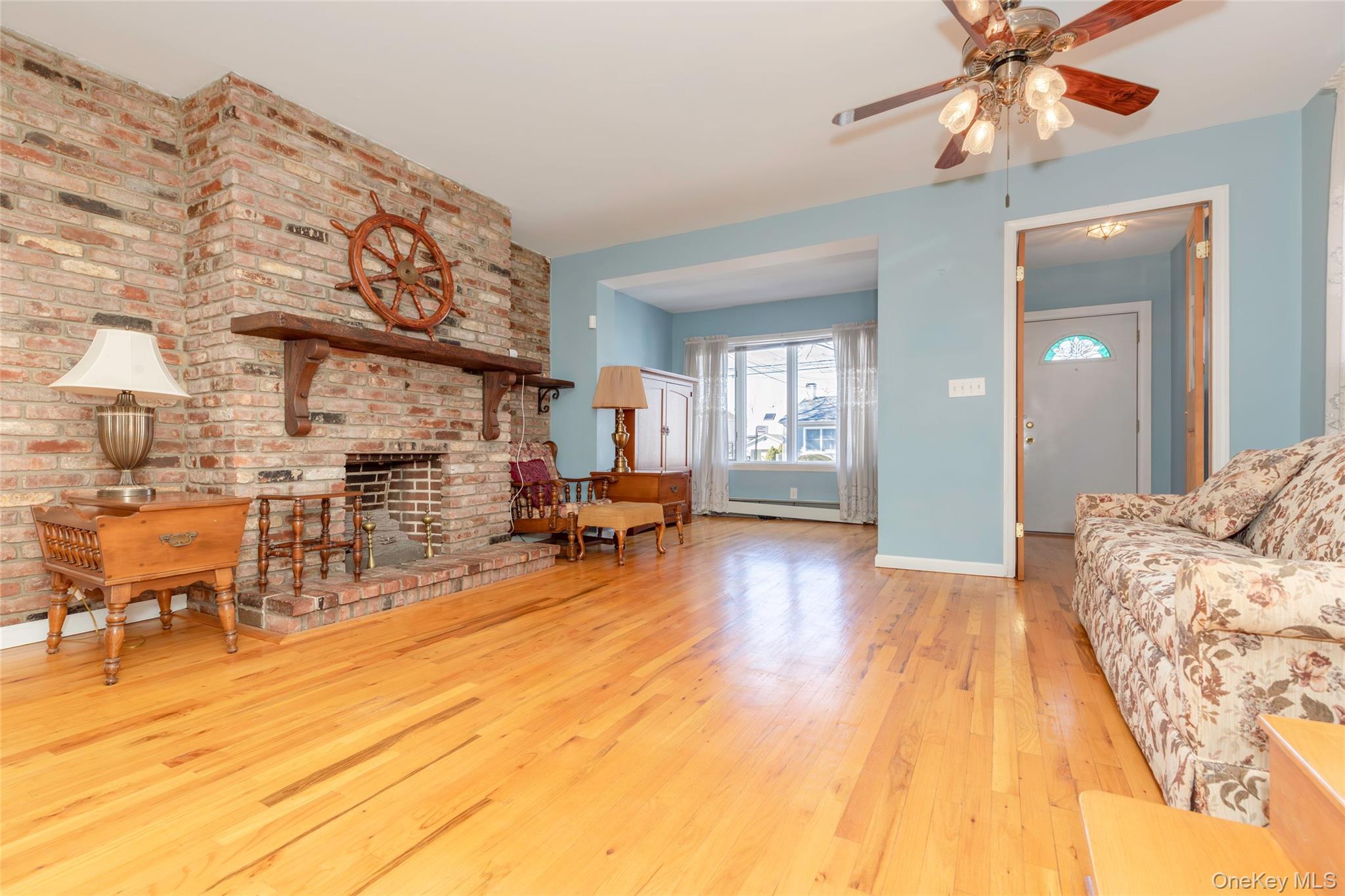 100 Marine Street Bronx, NY 10464 - Photo 5 of 25 a living room with furniture and a wooden floor