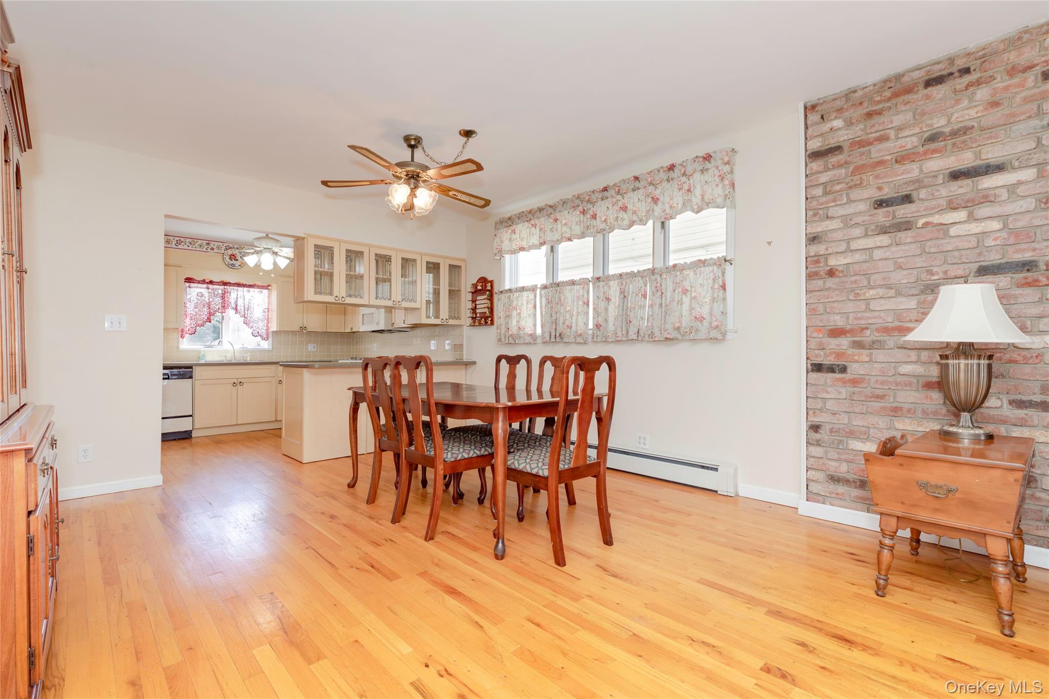 100 Marine Street Bronx, NY 10464 - Photo 7 of 25 a view of a dining room with furniture and chandelier