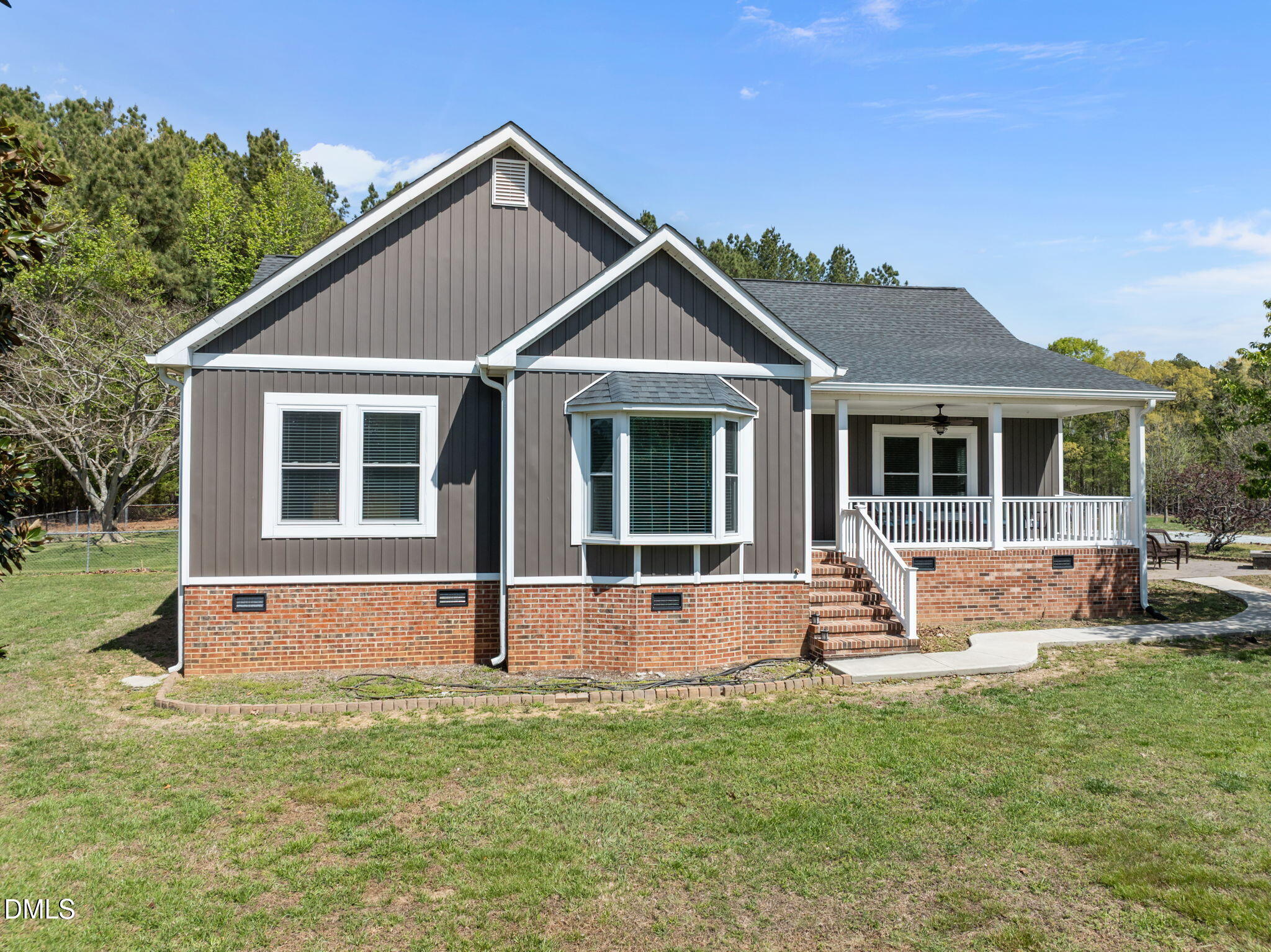 236 Dirgie Mine Road Roxboro, NC 27574 - Photo 12 of 55 a front view of a house with a yard