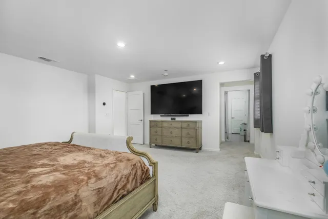 a bathroom with a double vanity sink mirror and shower