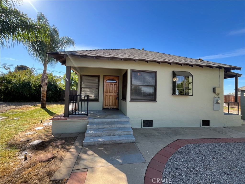 1026 5th Street Calimesa, CA 92320 - Photo 1 of 19 a front view of a house with garden