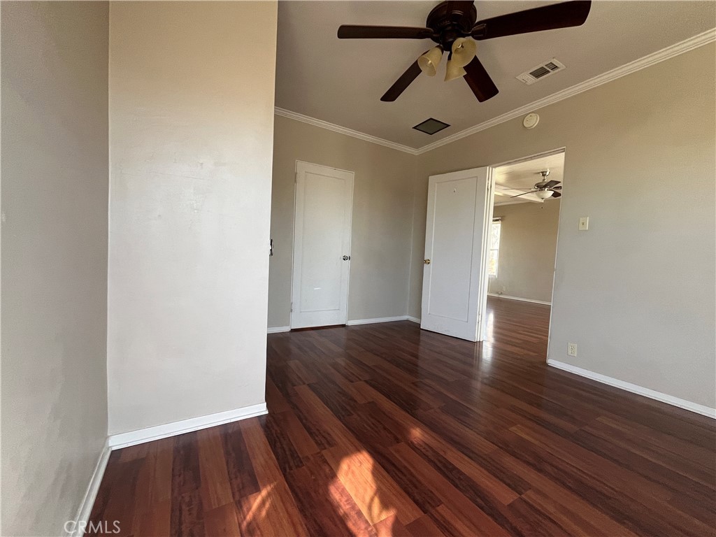 1026 5th Street Calimesa, CA 92320 - Photo 13 of 19 a view of empty room with wooden floor