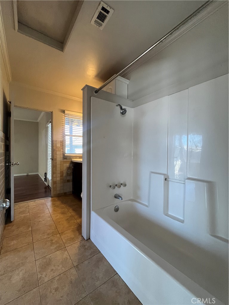 1026 5th Street Calimesa, CA 92320 - Photo 15 of 19 a bathroom with a bathtub and a shower
