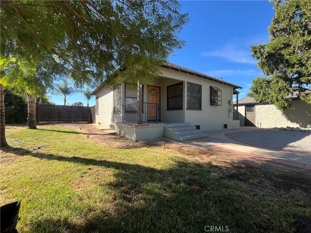 1026 5th Street Calimesa, CA 92320 - Photo 2 of 19 a front view of house with yard