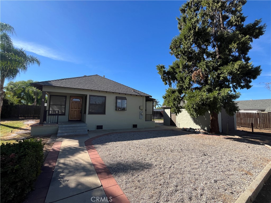 1026 5th Street Calimesa, CA 92320 - Photo 4 of 19 a front view of a house with a yard covered with snow