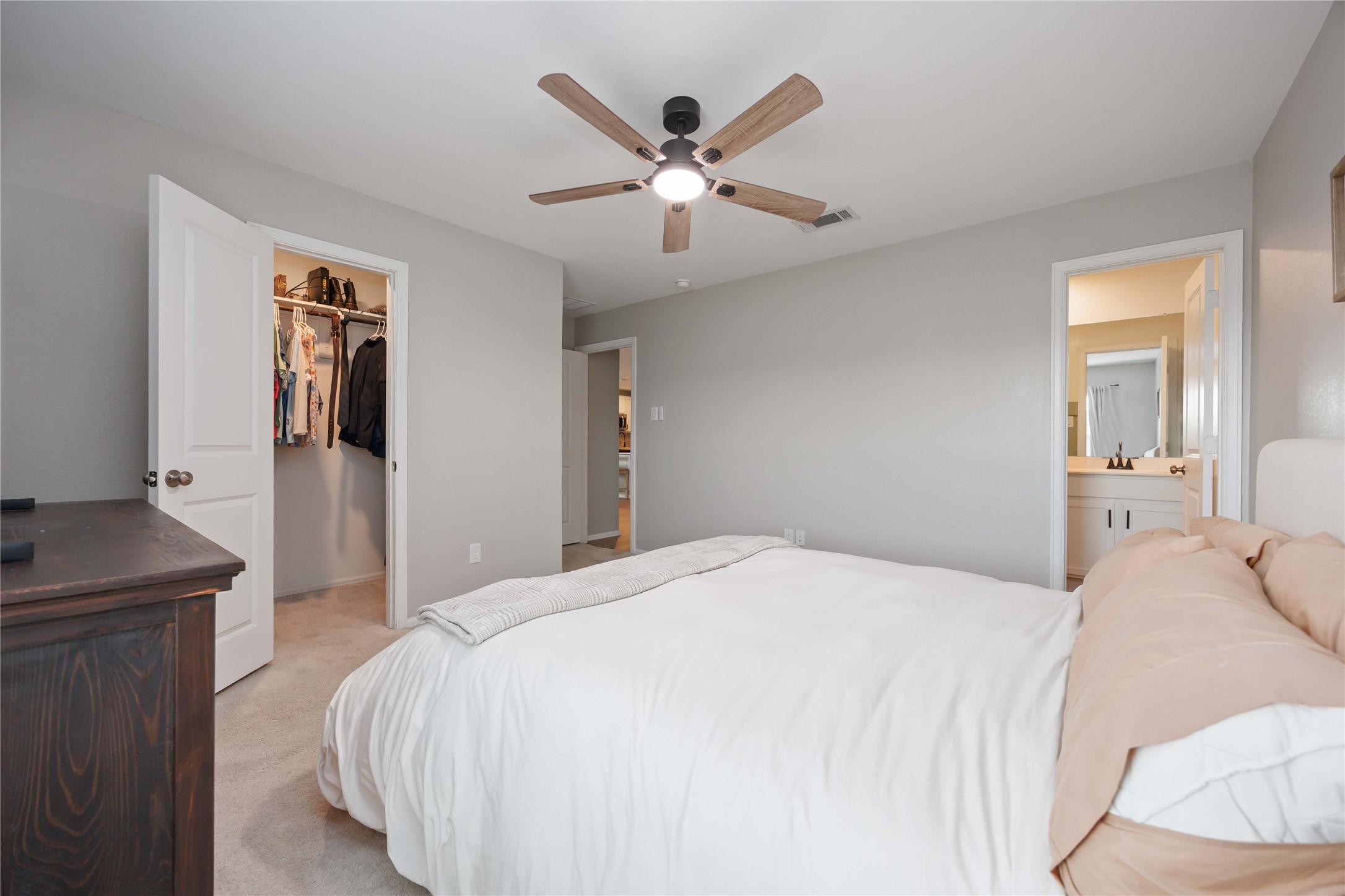 13920 Manatee Street Splendora, TX 77372 - Photo 13 of 25 Primary bedroom with walk in closet and en suite bathroom