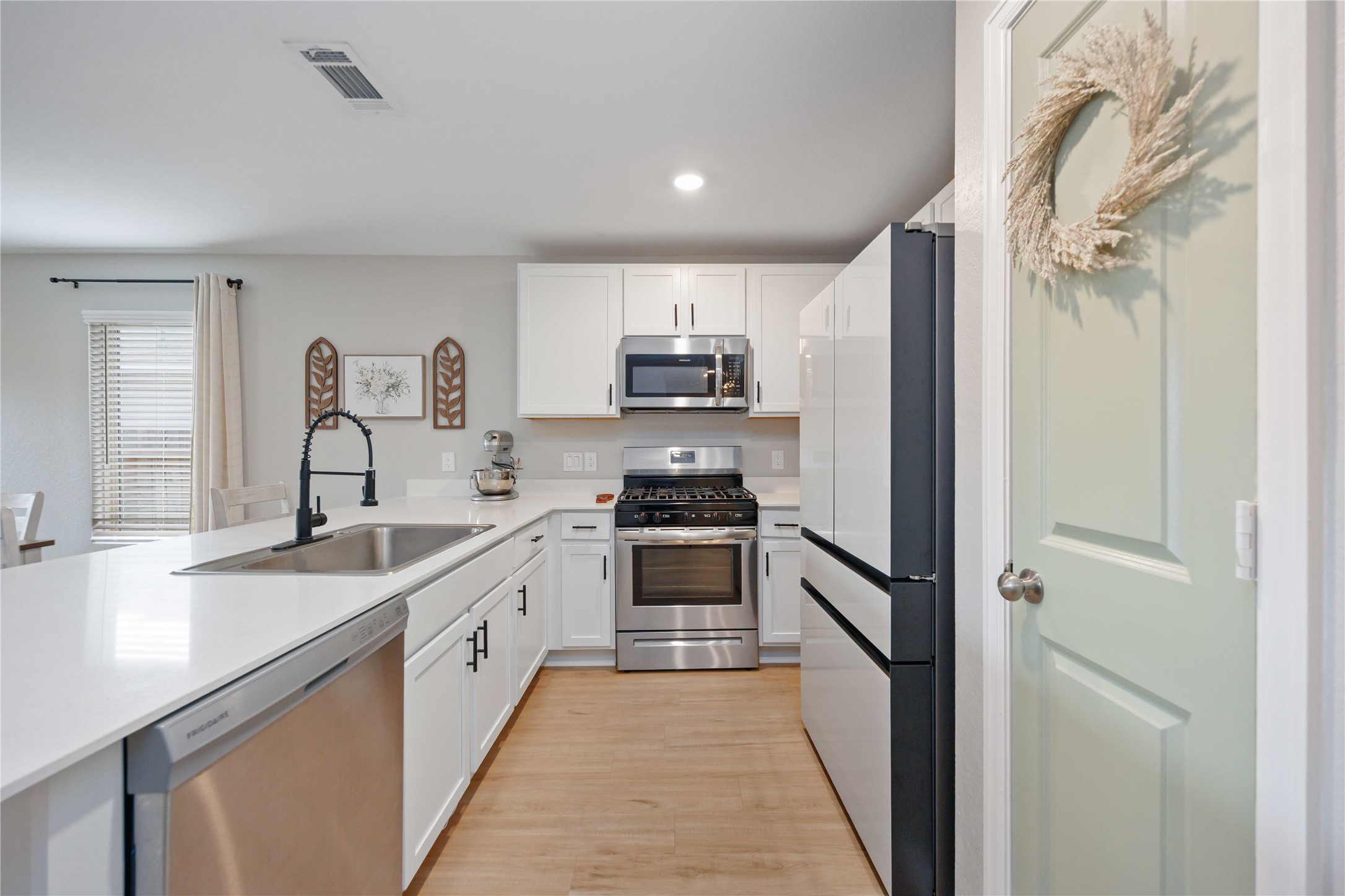 13920 Manatee Street Splendora, TX 77372 - Photo 5 of 25 Kitchen with pantry door to the right
