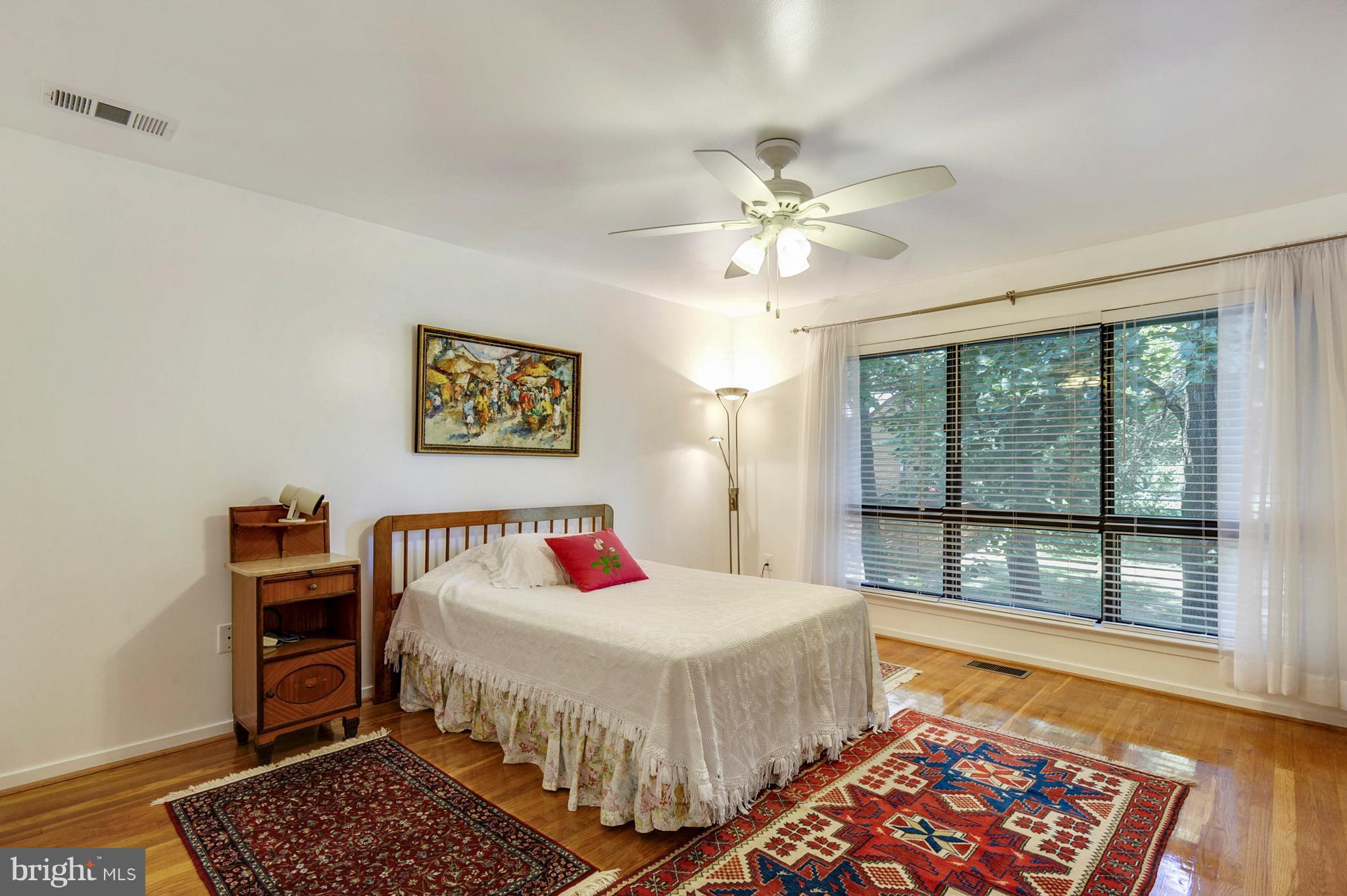 11796 Indian Ridge Road Reston, VA 20191 - Photo 15 of 30 a bedroom with furniture and a rug