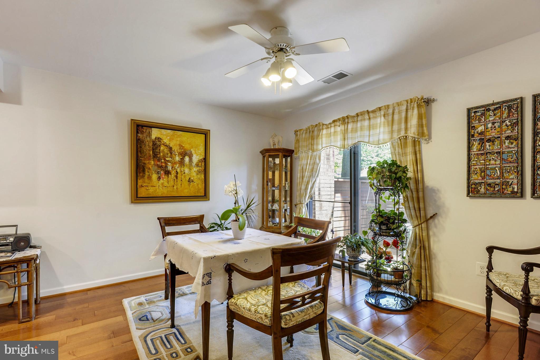 11796 Indian Ridge Road Reston, VA 20191 - Photo 5 of 30 a view of a dining room with furniture window and wooden floor
