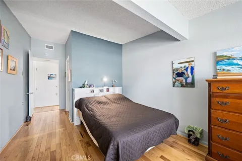 a bedroom with a bed and a view of bedroom