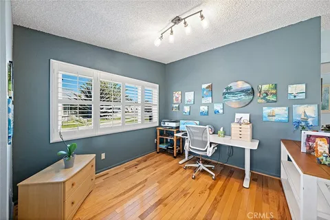 a room with a window and furniture