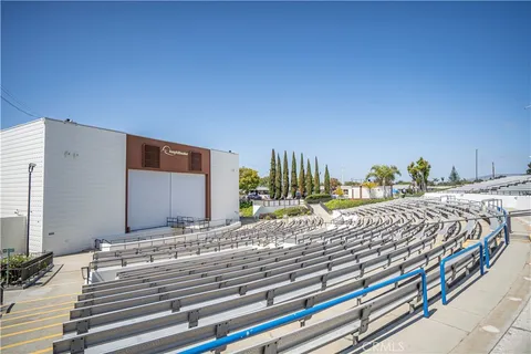 a bed sitting in a bedroom and chandelier