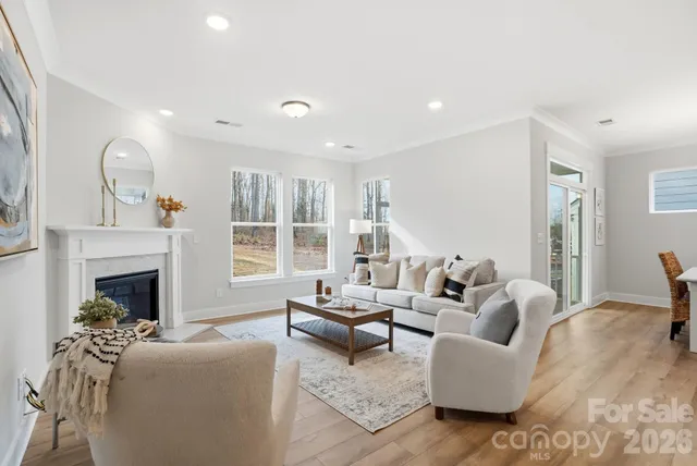 a living room with a fireplace and a fireplace