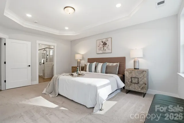 a bedroom with a bed and a lamp