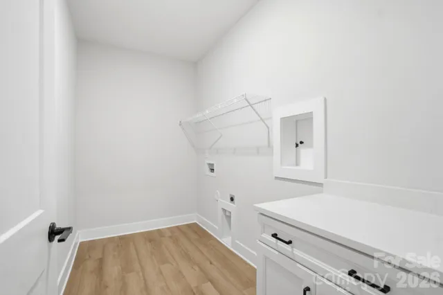 a view of a porch with wooden floor and iron stairs