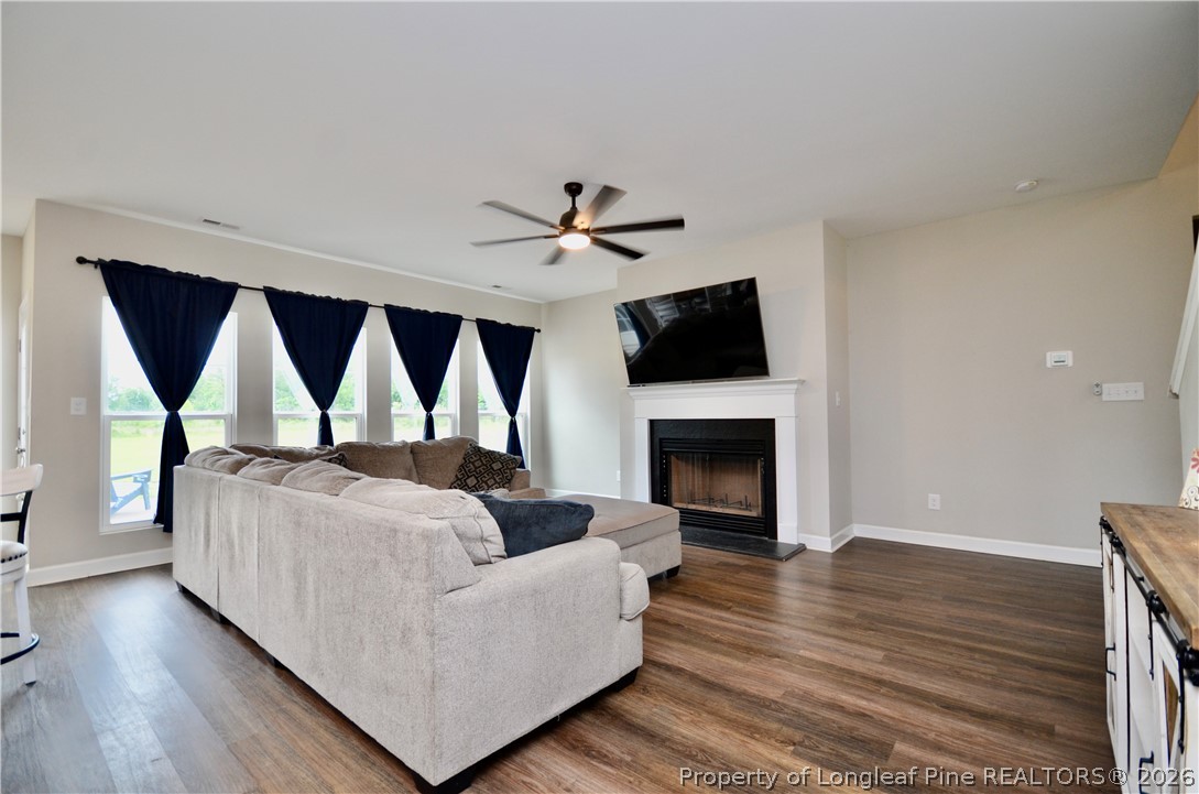 1865 John B Carter Road Fayetteville, NC 28312 - Photo 7 of 49 a living room with furniture and a fireplace