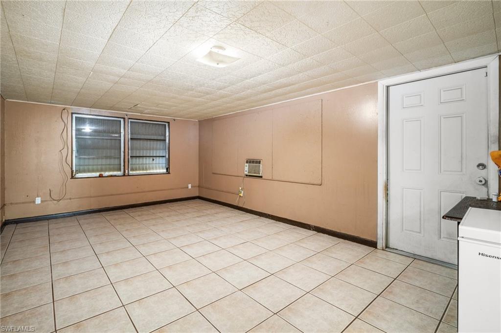 115 Georgia Road Lehigh Acres, FL 33936 - Photo 14 of 26 Spare room with baseboards