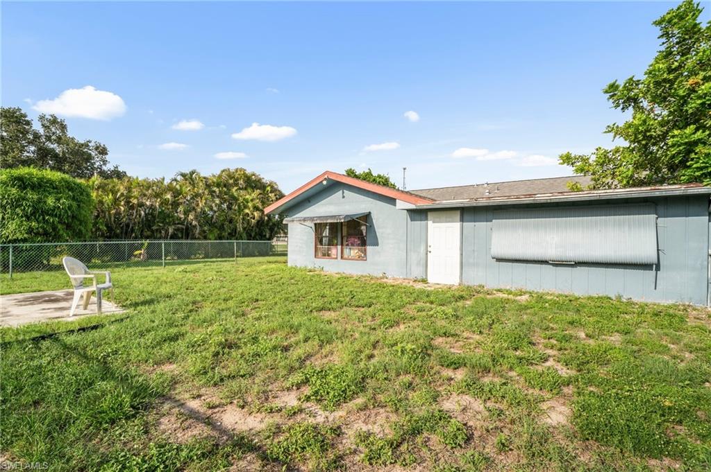 115 Georgia Road Lehigh Acres, FL 33936 - Photo 25 of 26 View of yard with a patio