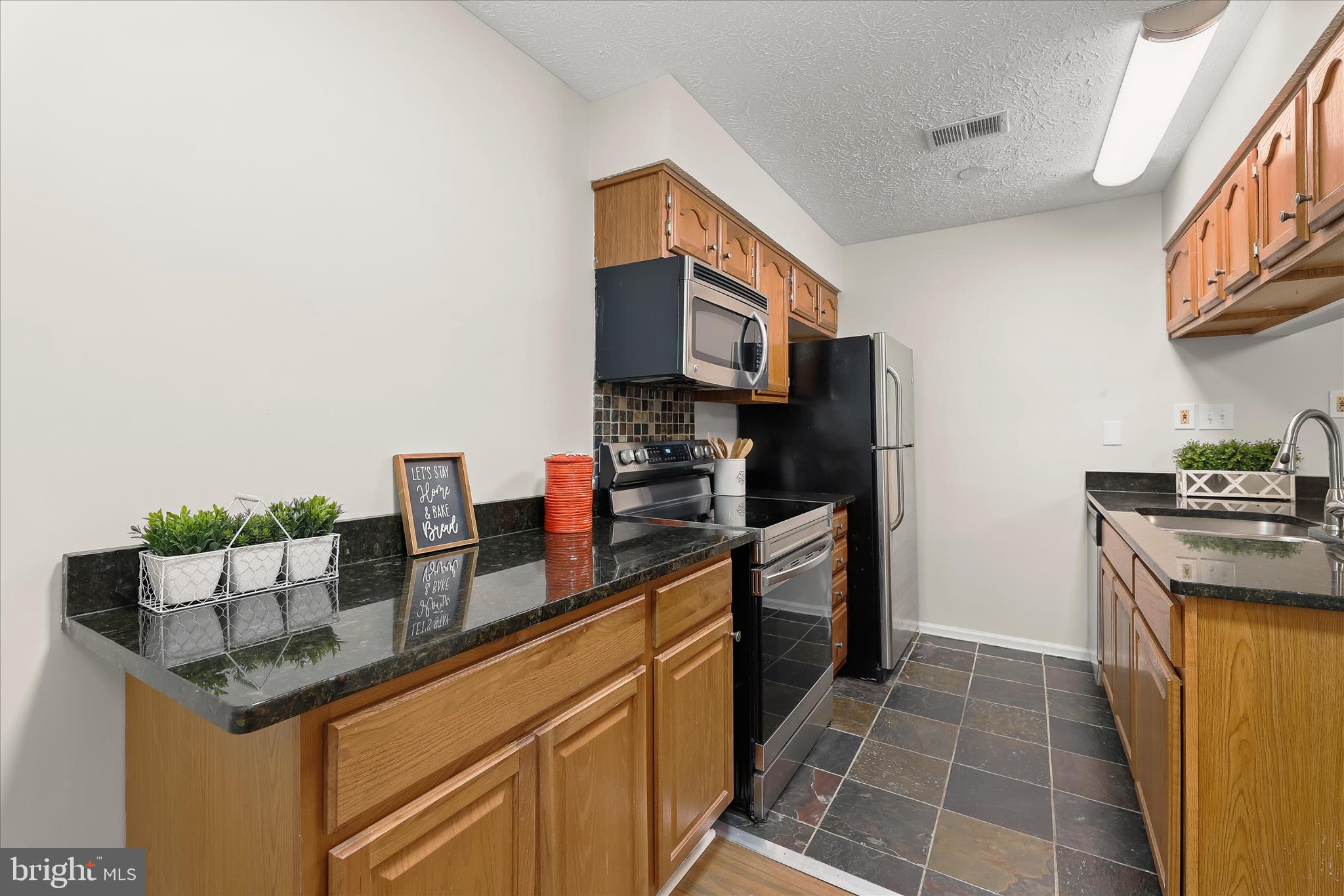 6420 Greenfield Road, Unit 810 Elkridge, MD 21075 - Photo 14 of 35 Additional cabinets and extended countertop