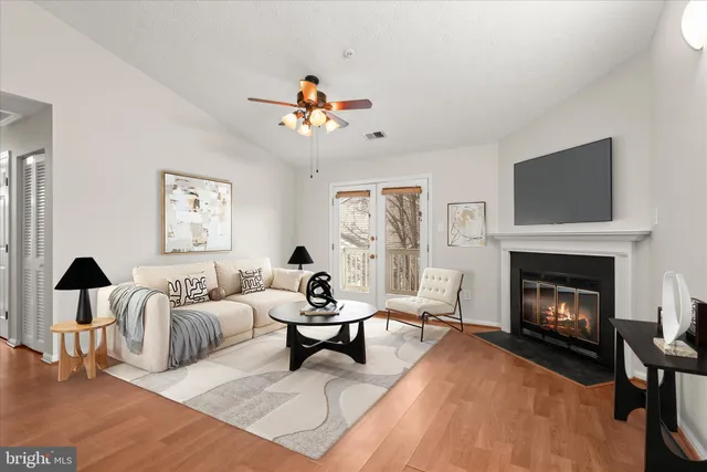 a living room with furniture fireplace and window