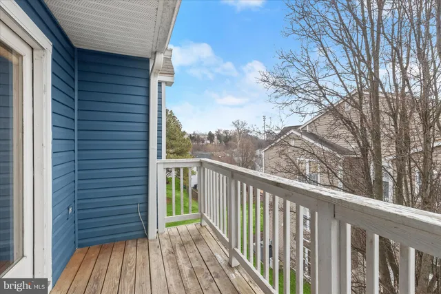 a view of a wooden deck and a yard