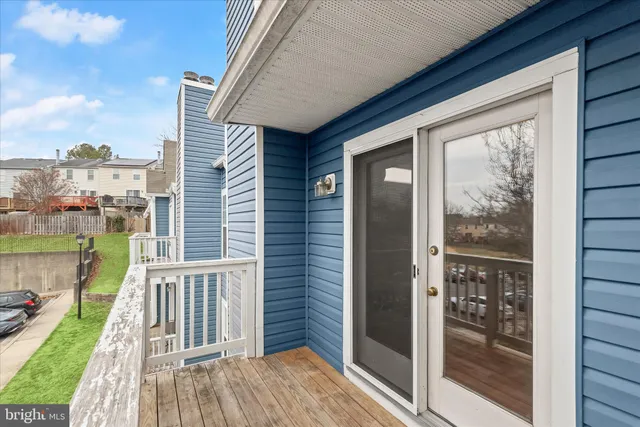 a view of a balcony with wooden floor