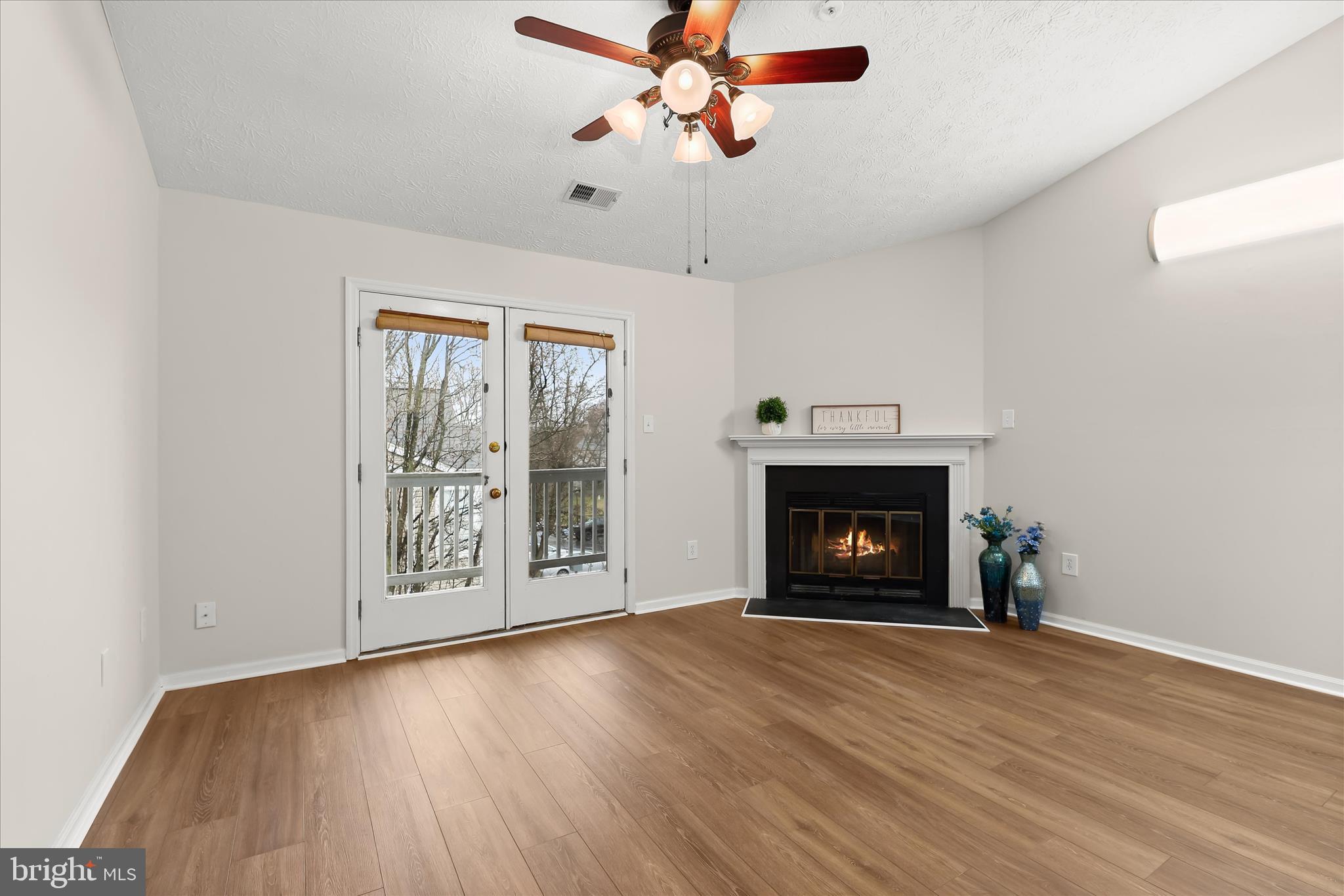 6420 Greenfield Road, Unit 810 Elkridge, MD 21075 - Photo 8 of 35 Living Room w/ wood burning fireplace
