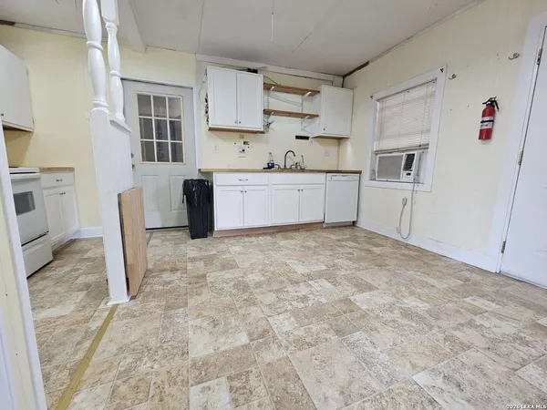 a view of livingroom with furniture and window