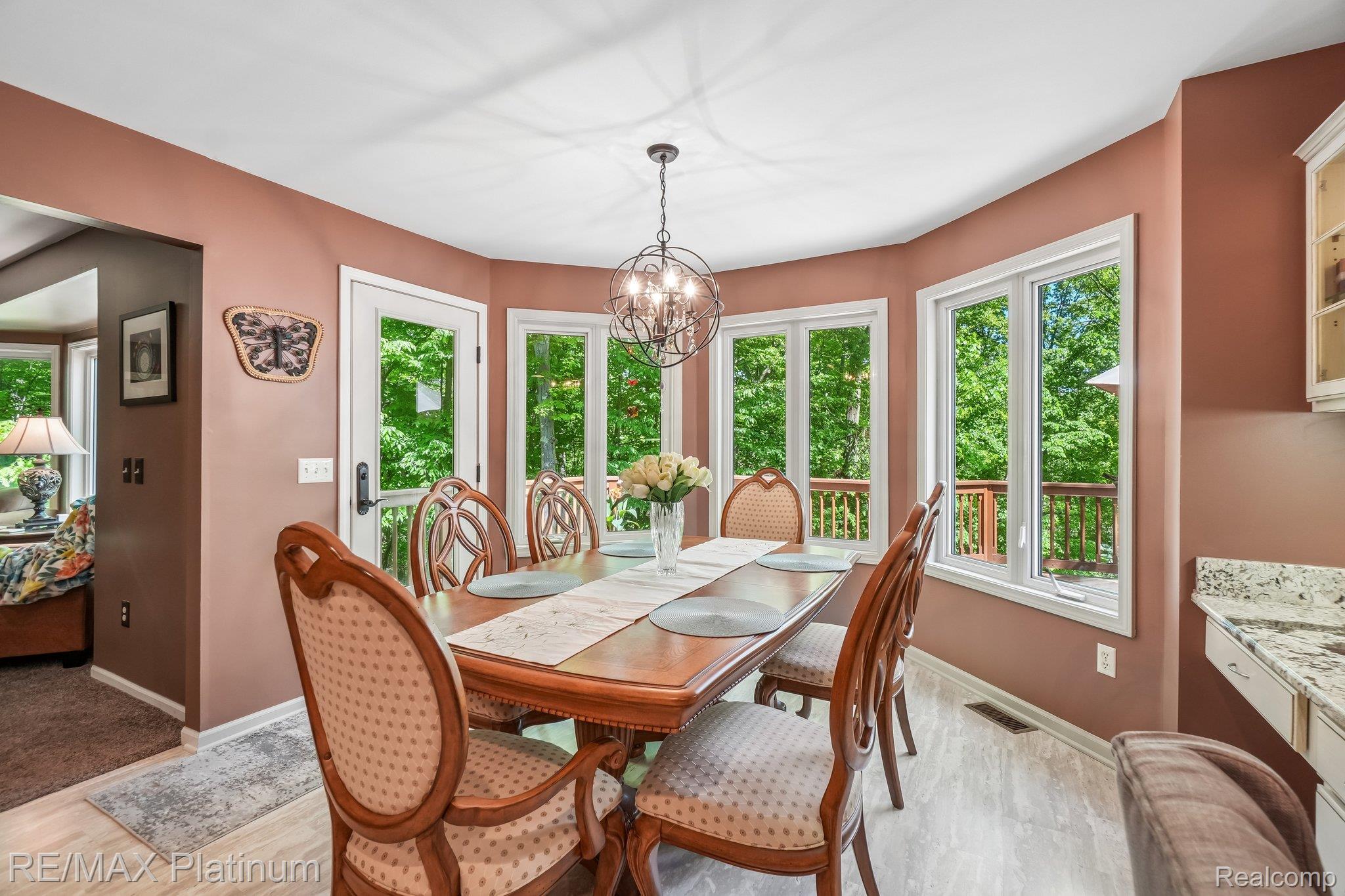 2260 Moorland's View Howell, MI 48855 - Photo 10 of 40 Dining area with bay windows and deck access