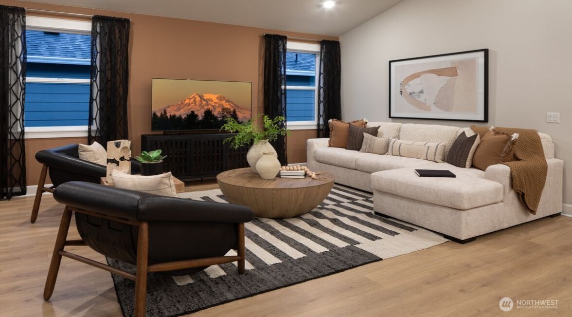 2946 Balsamroot Drive Southeast Lacey, WA 98513 - Photo 4 of 22 a living room with furniture and a flat screen tv