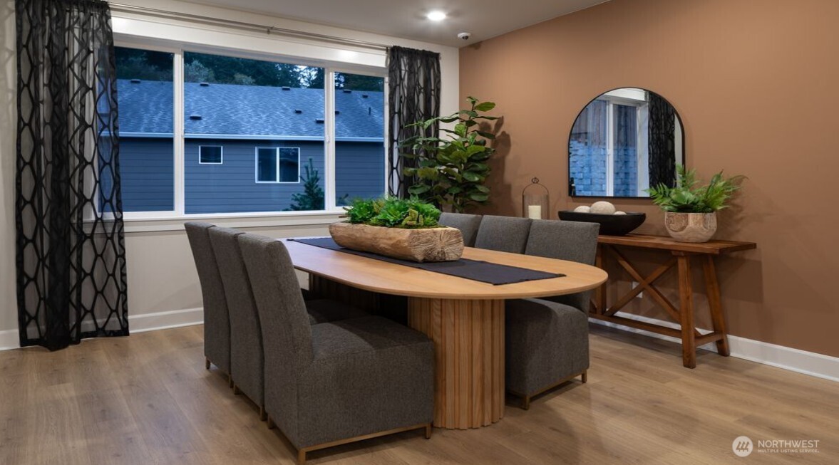 2946 Balsamroot Drive Southeast Lacey, WA 98513 - Photo 7 of 22 a view of a dining room with furniture and wooden floor
