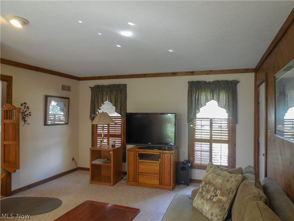 94 Hurd Road Aurora, OH 44202 - Photo 7 of 12 Family room is located off the kitchen and has a door to the garage.