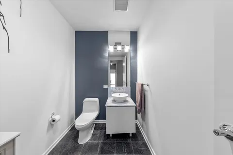a room with a chair and wooden floor