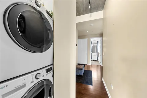 a view of a hallway with washer and dryer