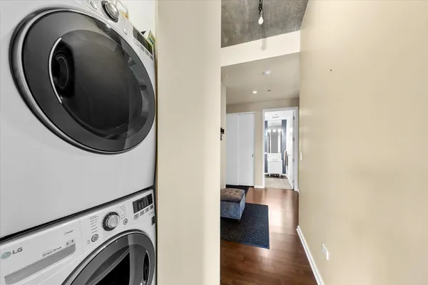 a view of a hallway with washer and dryer