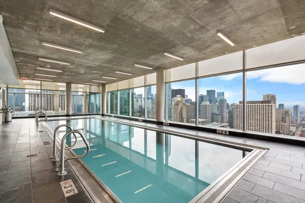a view of a swimming pool with a balcony