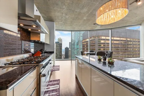 a kitchen with stainless steel appliances a counter space and a sink