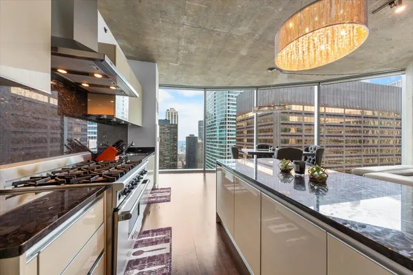 a kitchen with stainless steel appliances a counter space and a sink