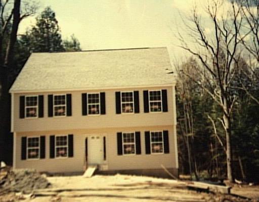 4 Turkey Hill Road Newtown, CT 06470 - Photo 1 of 1 a front view of a house with a yard