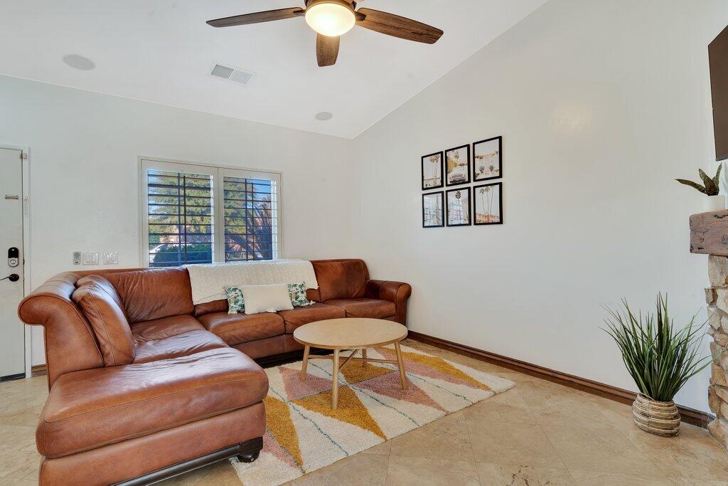 83347 Mango Walk Indio, CA 92201 - Photo 20 of 49 a living room with furniture and a large window
