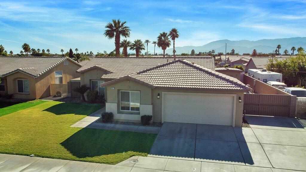 83347 Mango Walk Indio, CA 92201 - Photo 48 of 49 a view of a house with a yard